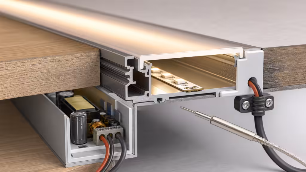 Completed LED aluminium profile assembly with wiring, diffuser, end cap, strain relief, and temperature sensor