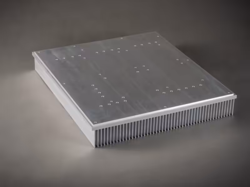 An aluminum base station heat sink shown from the flat mounting side, highlighting precision-drilled screw holes.