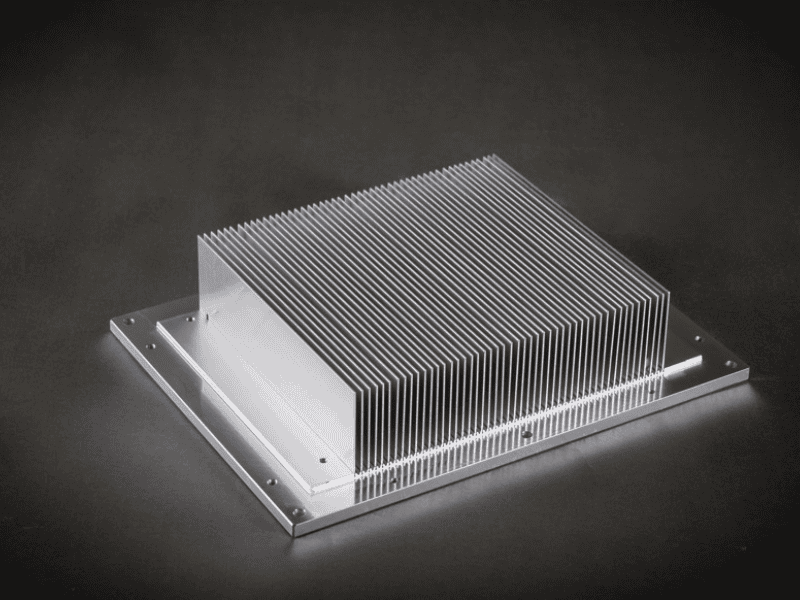 Close-up view of a bonded-fin (inserted fin) aluminum heat sink demonstrating the secure mechanical joint between the base and individual fins.