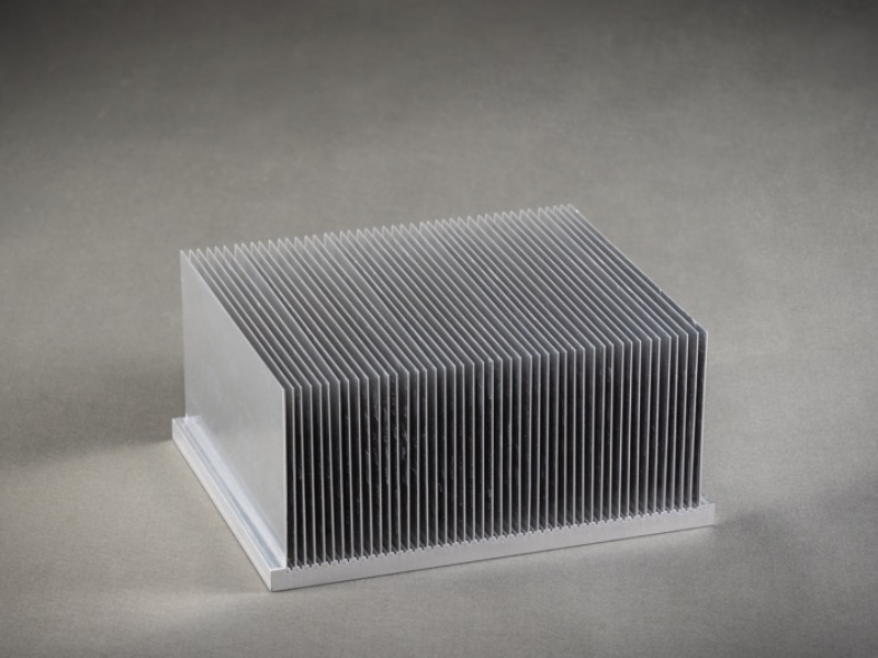 An assortment of silver and black aluminum extruded heat sinks in various sizes=