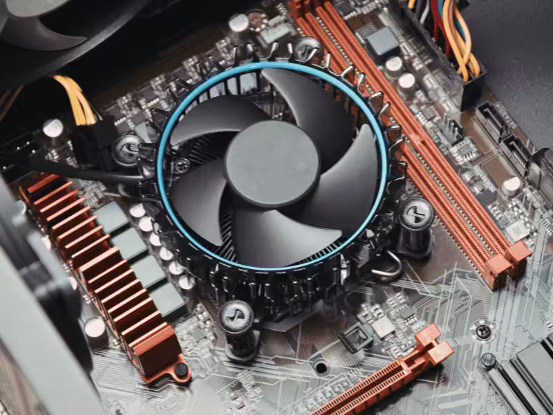 A circular CPU fan and heat sink installed on a computer motherboard.