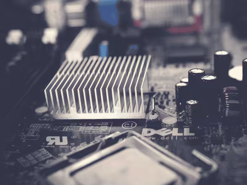 A small silver aluminum heat sink mounted on a motherboard chipset.