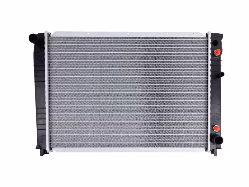 A standard automotive radiator with aluminum cooling fins and black plastic tanks.