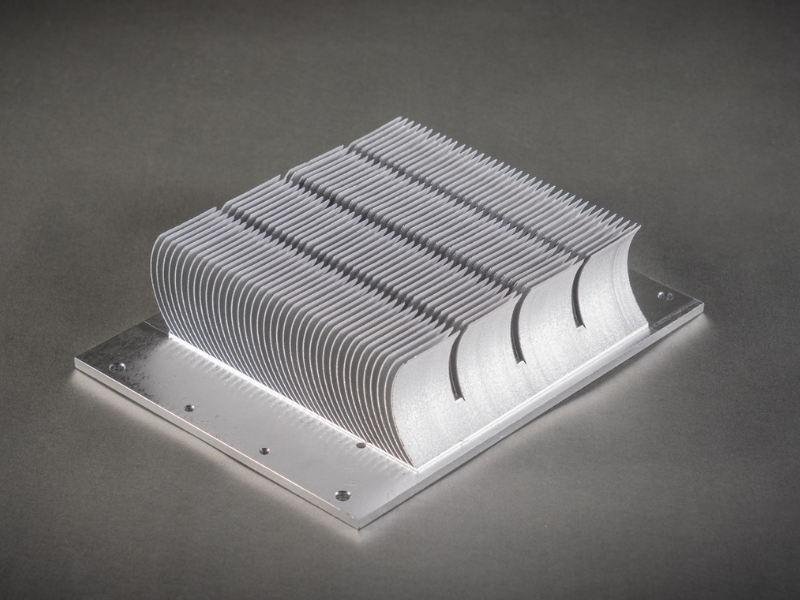 An assortment of silver and black aluminum extruded heat sinks in various sizes=